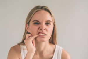 woman with gum pain